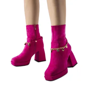 Pink insulated boots with a Saviore pendant